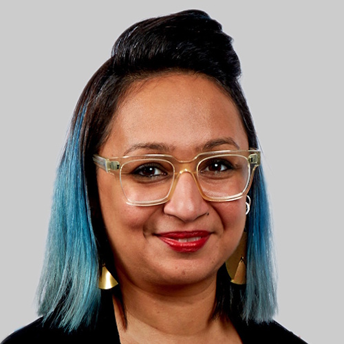 Roma Agrawal wearing a black top against a grey background